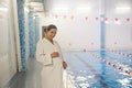 Young pregnant woman near a swimming pool. Royalty Free Stock Photo