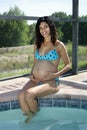 Young Pregnant Woman Poolside (1)