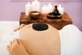 Young pregnant woman relaxing at Spa salon, Spa treatment, black