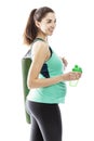 Young pregnant woman in sportswear with a fitness mat and a water bottle. Isolated on white background. Vertical Royalty Free Stock Photo