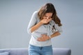 Young Pregnant Woman Suffering From Nausea