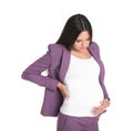 Young pregnant woman suffering from pain on white. Working while expecting baby Royalty Free Stock Photo