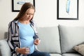 Young pregnant woman taking medicine at home Royalty Free Stock Photo