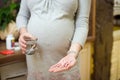 Young pregnant woman taking pills, Royalty Free Stock Photo