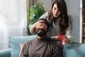 Young pregnant woman wants to surprise her husband with a positive pregnancy test and has tied a decorative bow to be her gift to Royalty Free Stock Photo