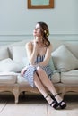 Young pregnant woman in white dress sitting Royalty Free Stock Photo