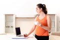 The young pregnant woman working at home Royalty Free Stock Photo