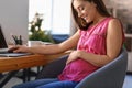 Young pregnant woman working at home Royalty Free Stock Photo