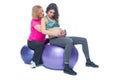 Young pregnant woman exercising with physiotherapist in birthing school. Doctor`s help conceptat in antenatal class Royalty Free Stock Photo