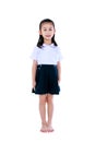 Young preschool child in uniform smiling at studio. Isolated on