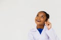 Young preteen African American kid wearing lab coat thinking