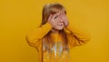 Young preteen child girl closing eyes with hand showing stop gesture, confused shy scared to watch Royalty Free Stock Photo