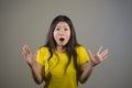 Young pretty and amazed Asian Korean girl astonished and shocked in wonder and surprise gesturing with hands and wide open mouth i Royalty Free Stock Photo