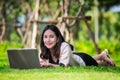 Young pretty asia woman with laptop typing