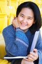 Young Pretty Asian Student with book