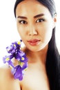 Young pretty asian woman with flower orchid close up isolated sp Royalty Free Stock Photo