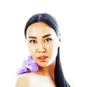 Young pretty asian woman with flower orchid close up isolated sp Royalty Free Stock Photo