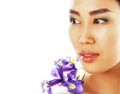 Young pretty asian woman with flower orchid close up isolated sp Royalty Free Stock Photo