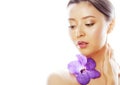 Young pretty asian woman with flower orchid close up isolated Royalty Free Stock Photo