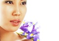 Young pretty asian woman with flower orchid close up isolated sp Royalty Free Stock Photo