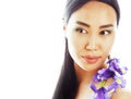 Young pretty asian woman with flower orchid close up isolated sp Royalty Free Stock Photo