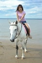 Young pretty asian woman riding white horse Royalty Free Stock Photo