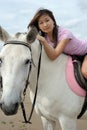 Young pretty asian woman riding white horse Royalty Free Stock Photo