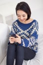 Young pretty Asian woman with smart phone. Royalty Free Stock Photo