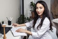 young pretty asian woman in white form working in clinic with laptop, lifestyle working people concept Royalty Free Stock Photo
