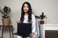 young pretty asian woman in white form working in clinic with laptop, lifestyle working people concept Royalty Free Stock Photo