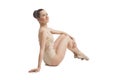 Young pretty ballet dancer sitting in elegant pose Royalty Free Stock Photo