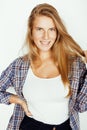 Young pretty blond girl hipster posing frendly against white background wall, smiling woman with long hair