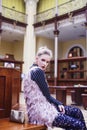 Young pretty blond girl posing in fashion style at vintage europe hall interior, lifestyle rich people concept