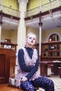 Young pretty blond girl posing in fashion style at vintage europe hall interior, lifestyle rich people concept