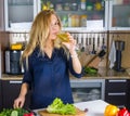 Young pretty blond woman cooking Royalty Free Stock Photo