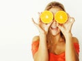 Young pretty blond woman with half oranges close up isolated on Royalty Free Stock Photo