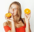 young pretty blond woman with half oranges close up isolated on white bright teenage smiling Royalty Free Stock Photo