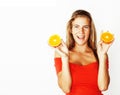 Young pretty blond woman with half oranges close up isolated on Royalty Free Stock Photo