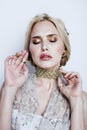 Young pretty blond woman in luxury jewelry, lifestyle rich people concept Royalty Free Stock Photo