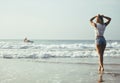 Young pretty blond woman at seacoast walking relaxing, fashion lady sunset, people on summer vacation concept