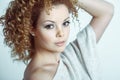Young pretty blond woman sensualy posing. Curly hair style Royalty Free Stock Photo