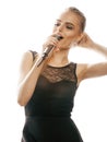 Young pretty blond woman singing in microphone Royalty Free Stock Photo