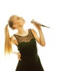 Young pretty blond woman singing in microphone isolated close up karaoke Royalty Free Stock Photo