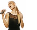 Young pretty blond woman singing in microphone isolated close up karaoke Royalty Free Stock Photo