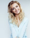 Young pretty blond woman smiling on white Royalty Free Stock Photo