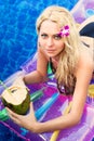 Young pretty blonde woman on air mattress swimming pool Royalty Free Stock Photo