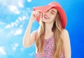 Young pretty blonde woman wearing summer hat and dress isolated on white background preparing to vacations Royalty Free Stock Photo