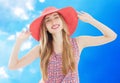 Young pretty blonde woman wearing summer hat and dress isolated on white background preparing to vacations Royalty Free Stock Photo