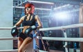 Young pretty boxer woman standing on ring Royalty Free Stock Photo