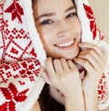 Young pretty brunette girl in Christmas ornament blanket getting warm on cold winter, freshness beauty concept Royalty Free Stock Photo